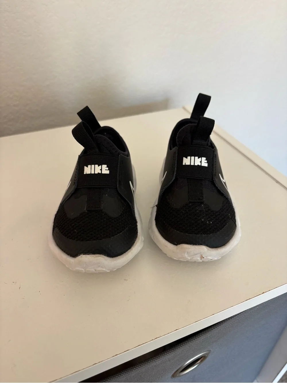 Nike Kids Black and White Swoosh Slip-On Sneakers